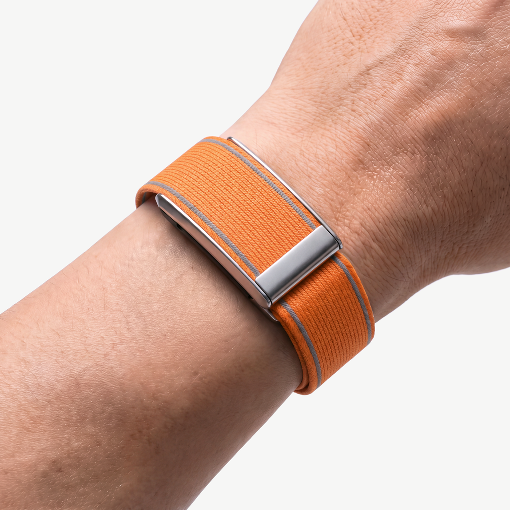 EdgeStitch Band Orange Silver — worn on wrist