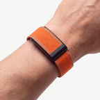 EdgeStitch Band Orange Noir — worn on wrist