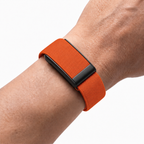 KnitLoop Band Orange — worn on wrist